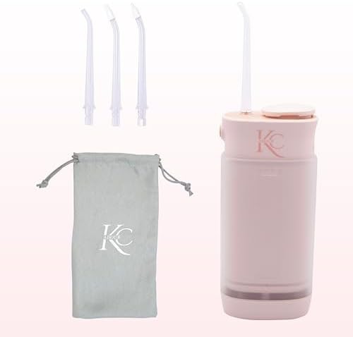 Pink travel friendly dental water flosser — photo 5