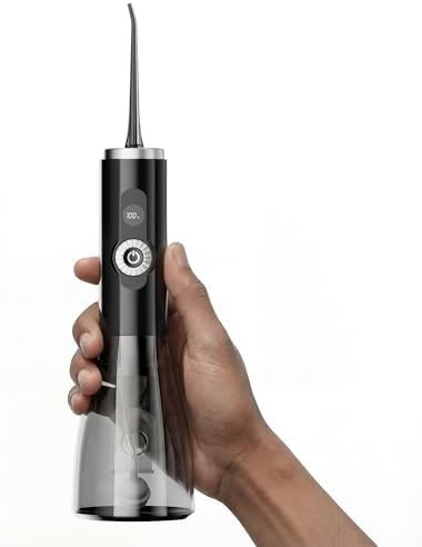 Black cordless flosser with variable pressure